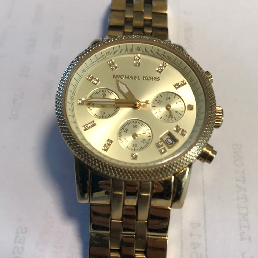 Gold Michael Kors Watch. Used but good condition.